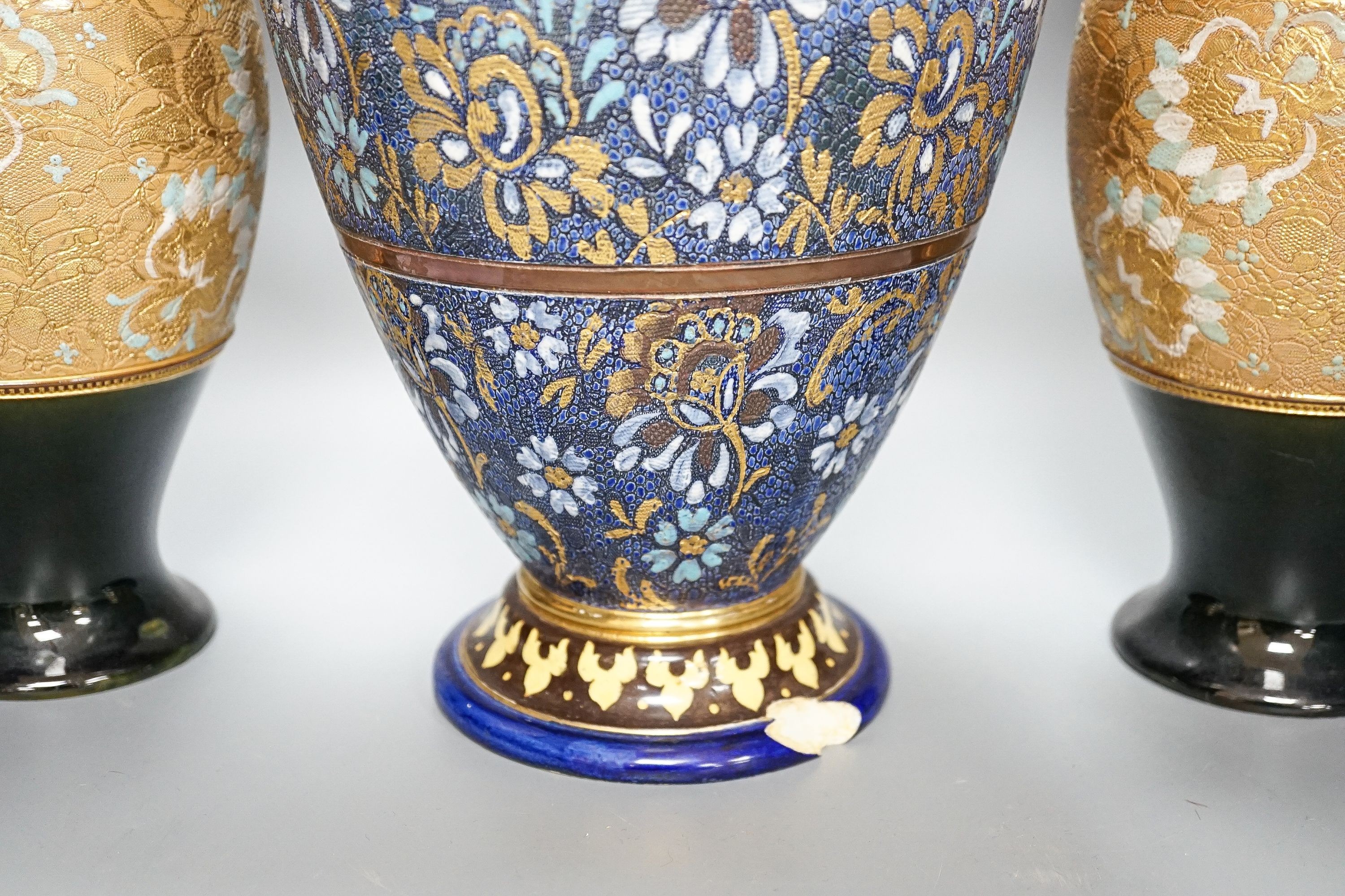 A large Doulton Slater's Patent vase, 46cm and a pair of similar smaller vases, 34cm